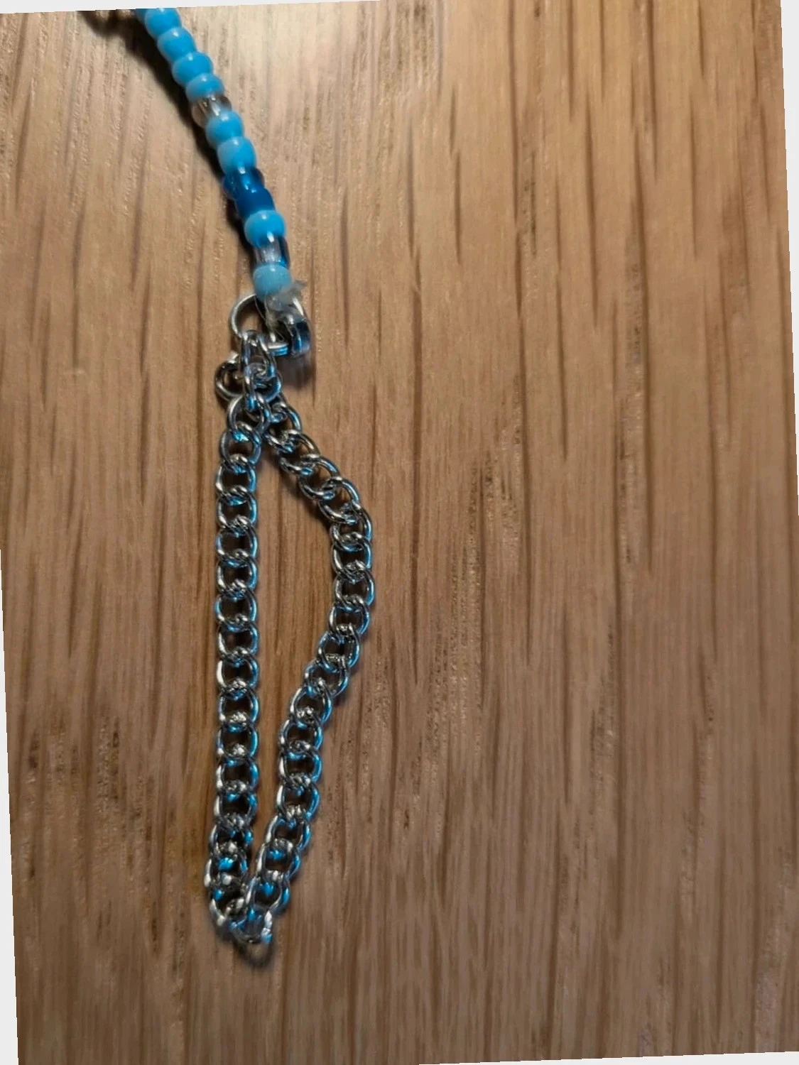 Fantaisie hanger armband met veer en verschillende blauwe parels – photo 4